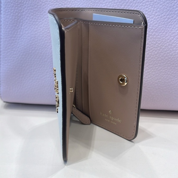 Kate Spade Madison Small Bifold Wallet
Meringue 
NWT - Picture 10 of 16